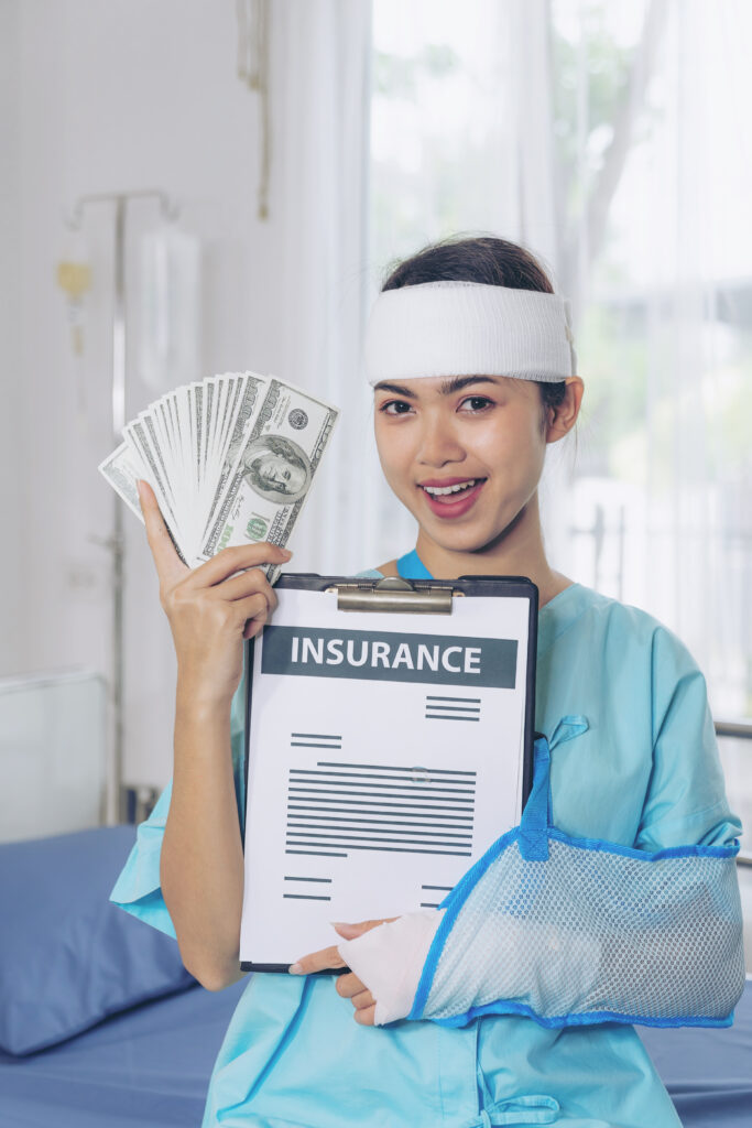 accident patients injury woman wheelchair hospital holding us dollar bills feel happy from getting insurance money from insurance companies medical concept
