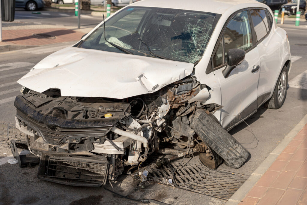 wrecked car with front end damage on street 2026 01 06 10 48 17 utc 1