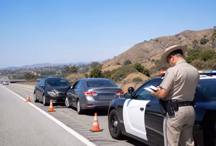 CHP officer documenting a Southern California freeway collision