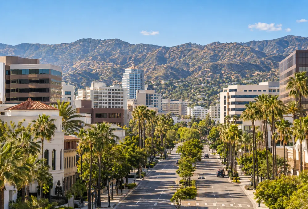 Illustration of a palm-lined Glendale, California boulevard with the Verdugo foothills